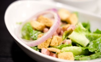 29352054 - closed up cropped bowl of caesar salad