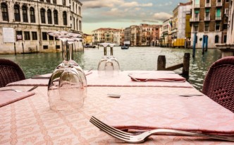28998787 - a romantic table set on the waterside in venice, italy